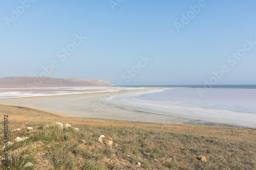Fototapeta Naklejka Na Ścianę i Meble -  Koyash pink lake in the Crimea in the summer. Amazing delicate pastel landscape. The concept of relaxation, tranquility, and peace. Natural background in light neutral shades for design, layouts.
