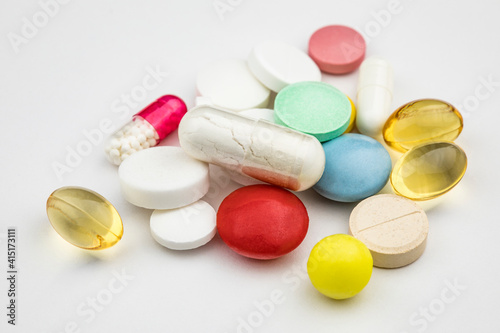 Multicolored tablets on white background. Health care concept.