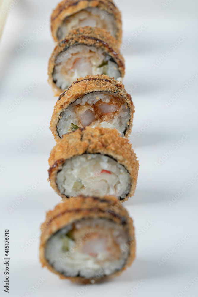 Crispy hot sushi rolls isolated on a white background Crispy hot sushi rolls isolated on a white background