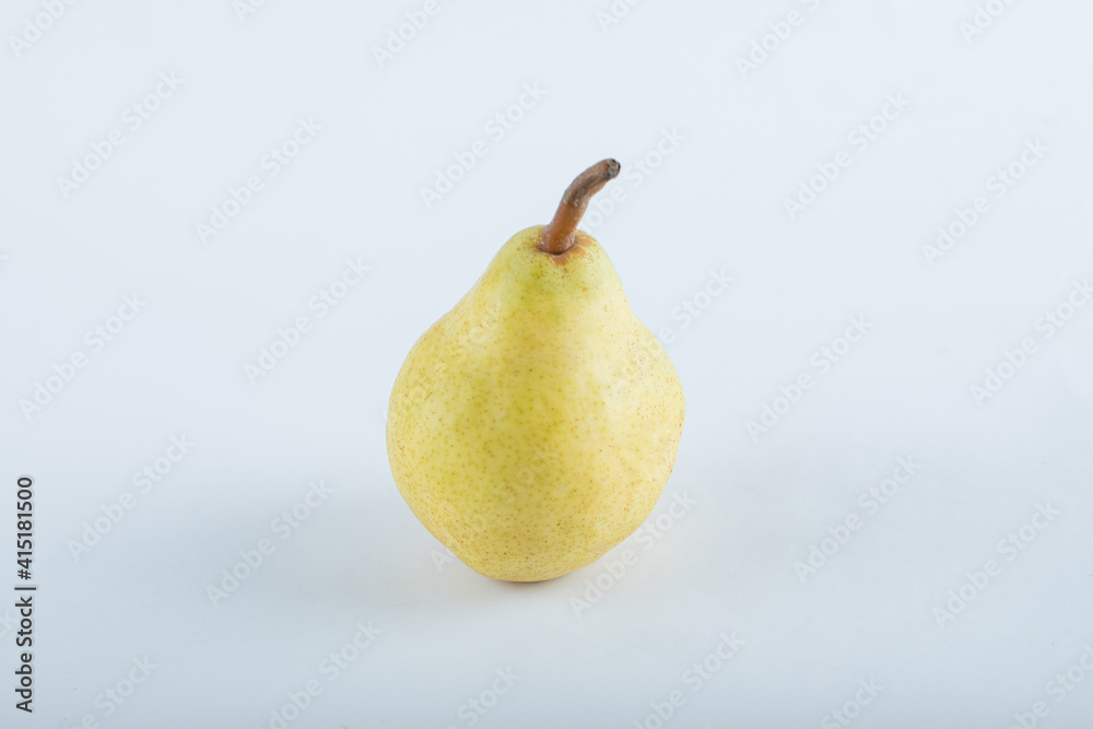 Pear against a white background. Soft focus. Pear against a white background. Soft focus.