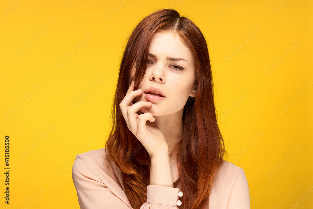 attractive woman posing glamor close-up yellow background attractive woman posing glamor close-up yellow background