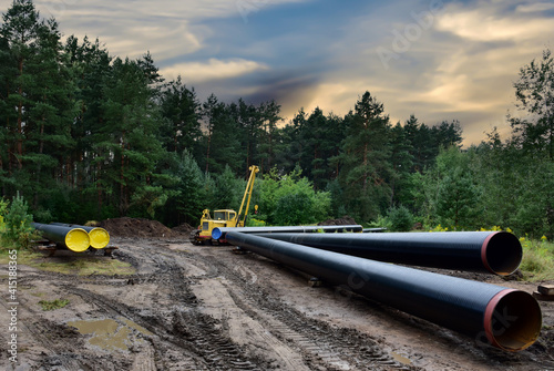 Oil and Gas Pipeline Construction. Natural Gas and Crude oil transmission in pipe from gas storage and plant development to facility. Building of transit petrochemical pipes in forest area