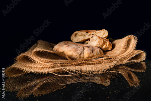 homemade bread on a linen cloath photo