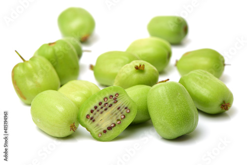 mini kiwi baby fruit (actinidia arguta) on white background  photo