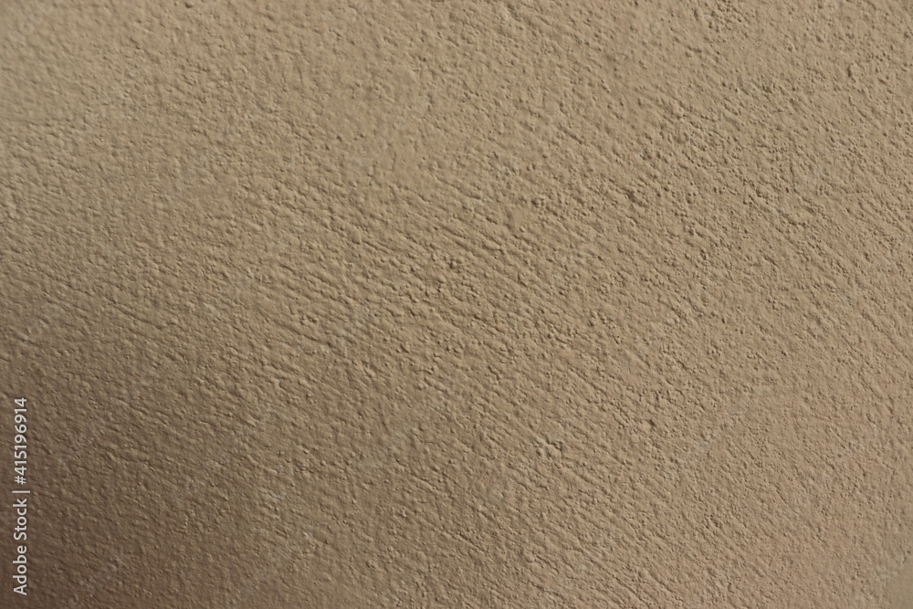 The walls are made of cream stucco, with a rough and rough surface. There is a blank space for the text. Ideas for background. The walls are made of cream stucco, with a rough and rough surface. There is a blank space for the text. Ideas for background.