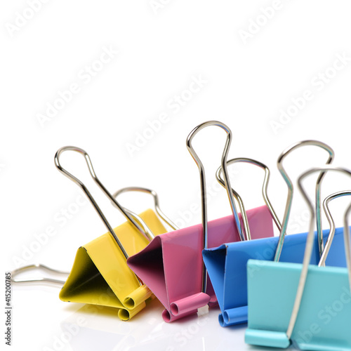 Four binder clips isolated on white background 