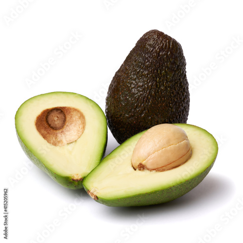 Halved avocado with seed isolated on a white background with clipping path