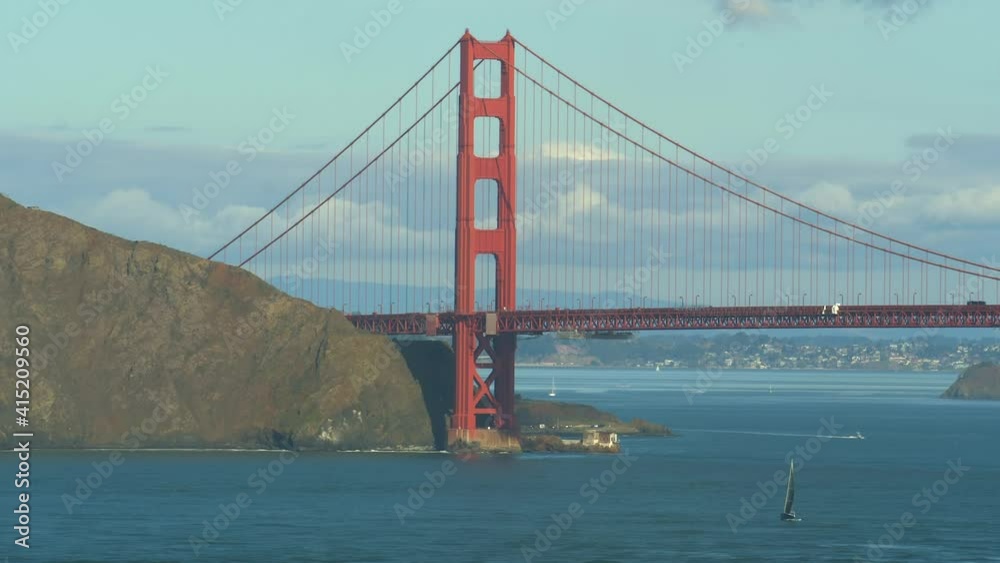 Famous red Golden Gate Bridge San Francisco at day time landscape with clouds Famous red Golden Gate Bridge San Francisco at day time landscape with clouds