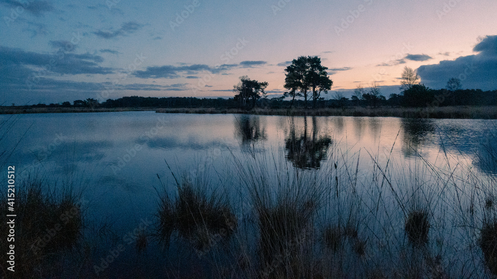 Naklejka premium sunset over lake 2