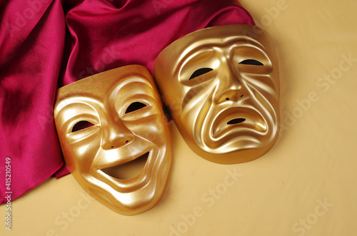 Принти на полотні Comedy and tragedy masks with purple drapery on a yellow background