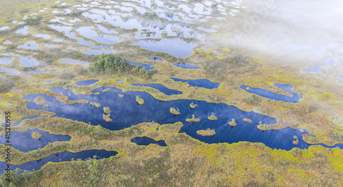 Aerial shot of beautiful Karula National Park full of lakes in Estonia photo