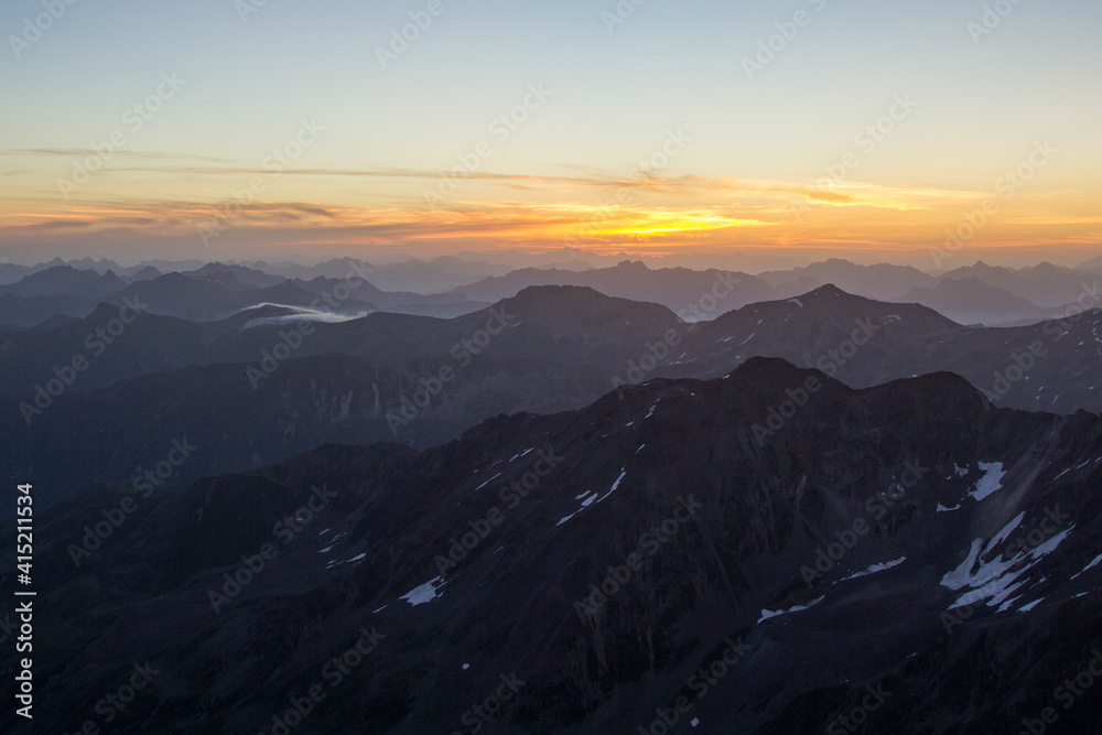 clear sky misty mountains sunrise in the swiss alps