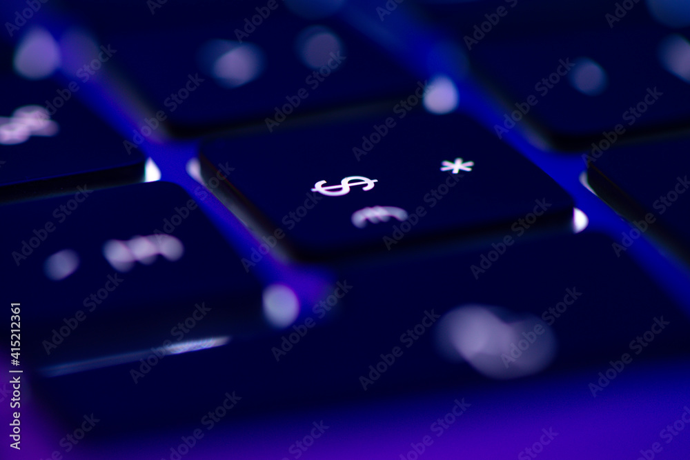 Gros plan sur la touche dollar et euros d'un clavier d'ordinateur