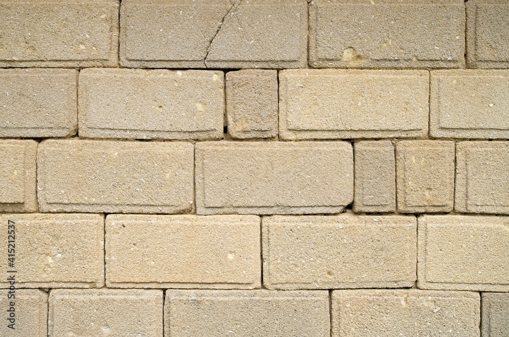 Obraz premium Old ecru stone wall close up