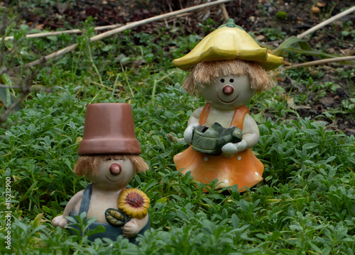 Wallpaper Mural Flowerpot siblings  weeding the Cerastium in an autumn garden. Torontodigital.ca