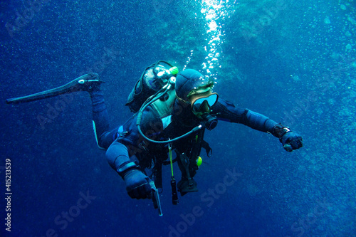 Scuba diver in the middle of bubbles photo