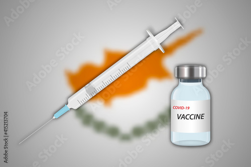 Syringe and vaccine vial on blur background with Cyprus flag,