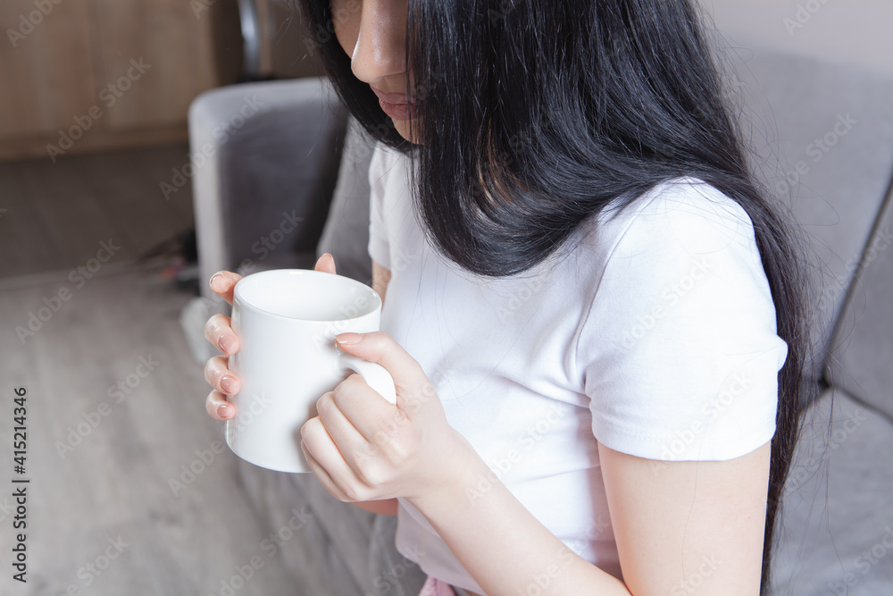 Close-up of female hands with a mug of drink. Close-up of female hands with a mug of drink.