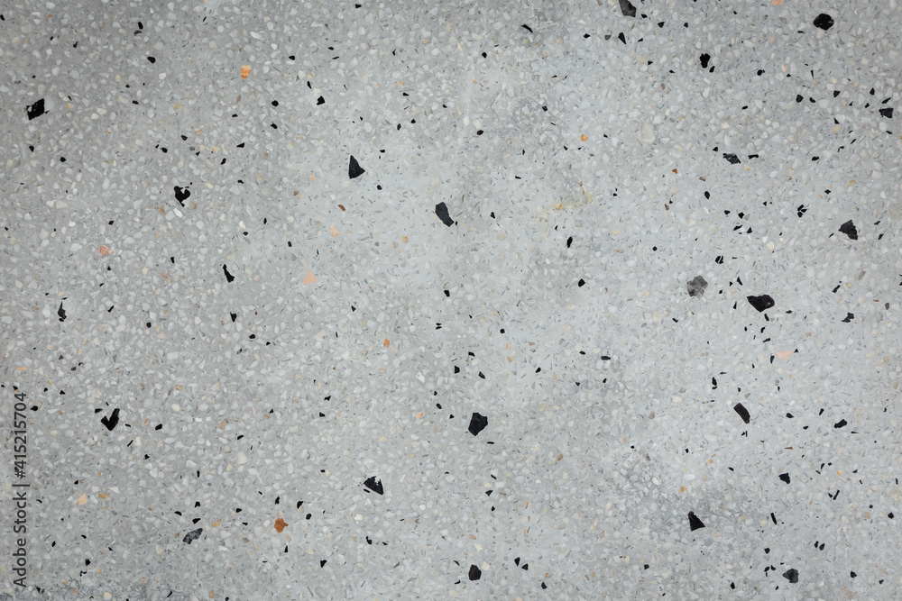 The gray terrazzo floor is a composite material, poured in place or precast, which is used for floor and wall treatments. The gray terrazzo floor is a composite material, poured in place or precast, which is used for floor and wall treatments.