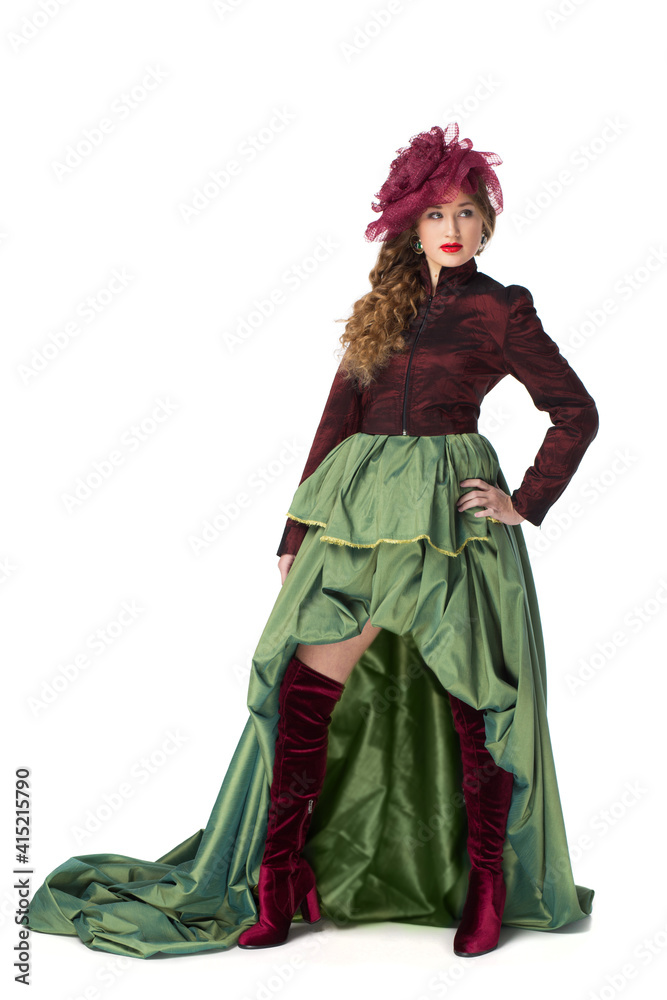 Fashion photo of a beautiful elegant young teenager girl with long curly hair in a pretty long green skirt and high boots isolated on white background. Fashion photo of a beautiful elegant young teenager girl with long curly hair in a pretty long green skirt and high boots isolated on white background.