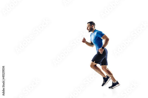Purpose. Caucasian professional male athlete, runner training isolated on white studio background. Muscular, sportive man. Concept of action, motion, youth, healthy lifestyle. Copyspace for ad.