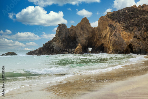 Pfeiffer Beach in Big Sur is an incredibly picturesque beach, beautiful landscape on the Pacific coast, rocks, sand, ocean and sky. Concept, vacation, photo for postcards, tourist and travel guide. photo