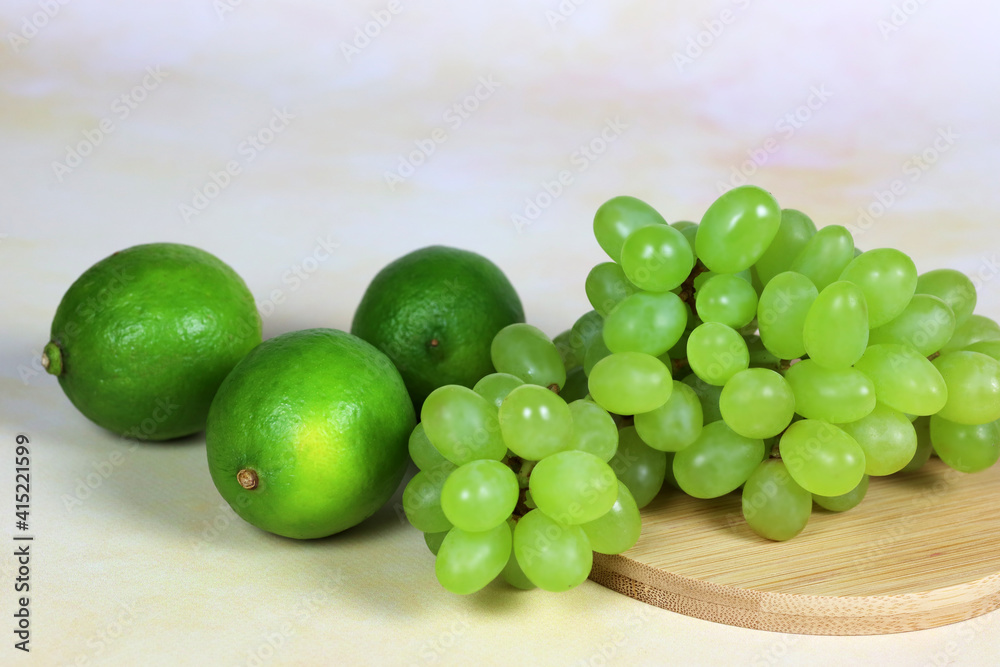 lime and grapes on the table, antioxidants and vitamin C lime and grapes on the table, antioxidants and vitamin C