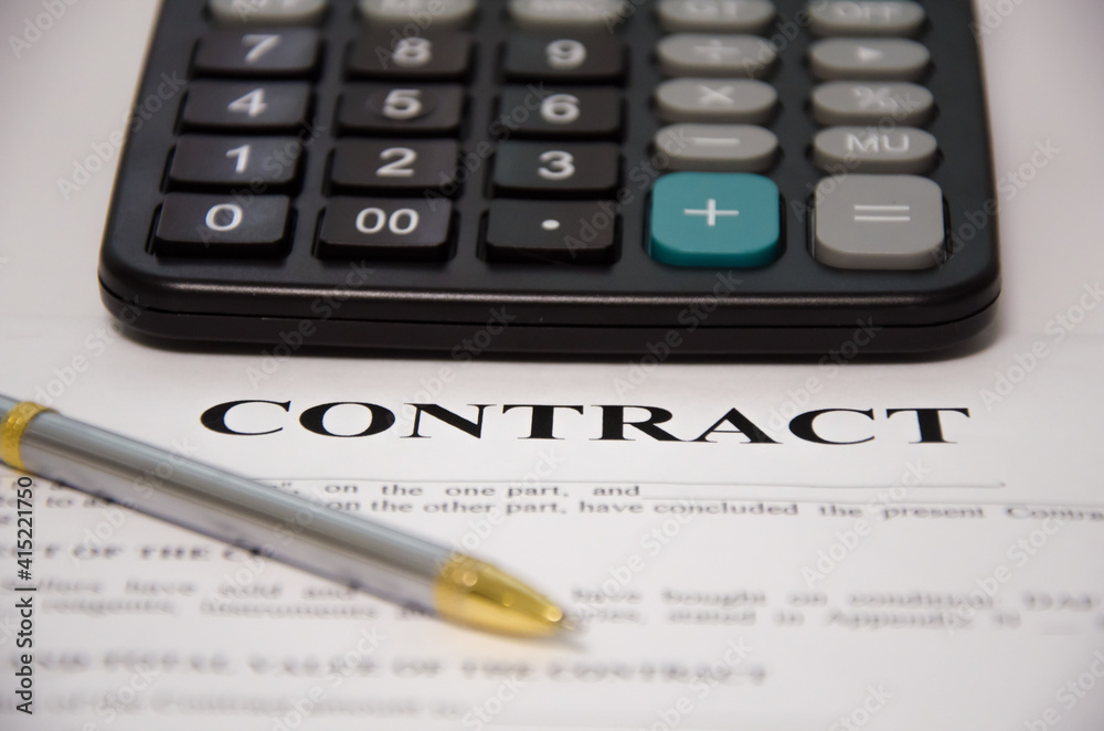 contract pen and calculator lie on a white background. sign contract. contract pen and calculator lie on a white background. sign contract.