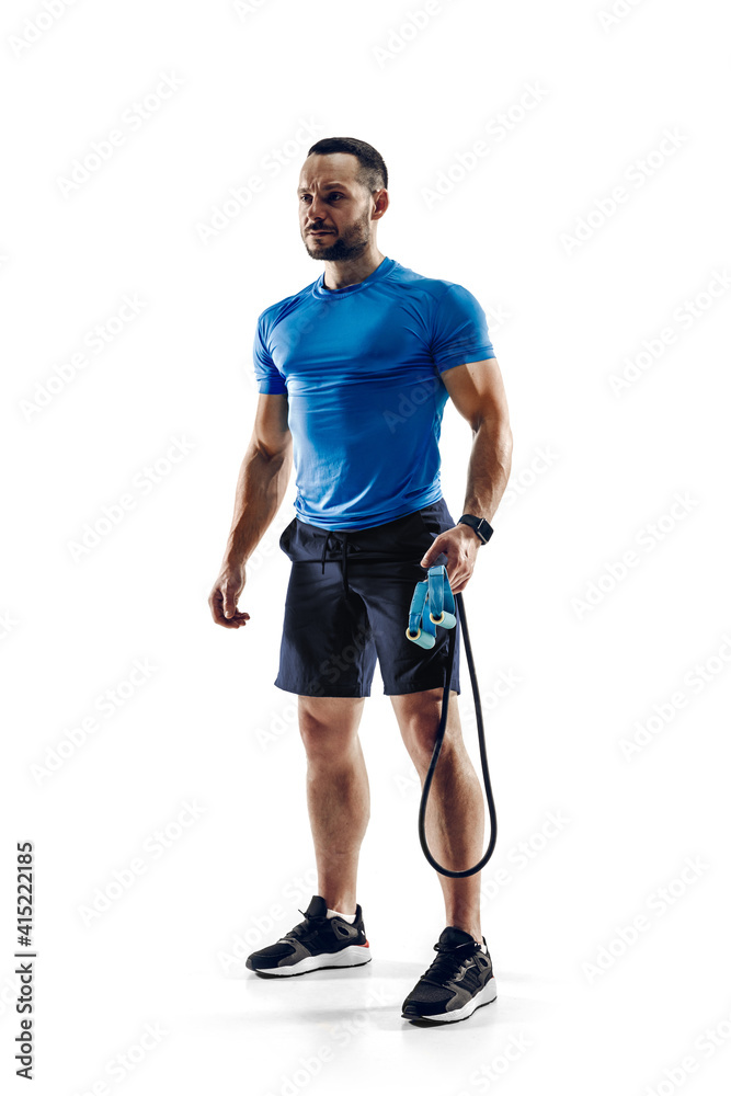 Ready. Caucasian professional male athlete, runner training isolated on white studio background. Muscular, sportive man. Concept of action, motion, youth, healthy lifestyle. Copyspace for ad.