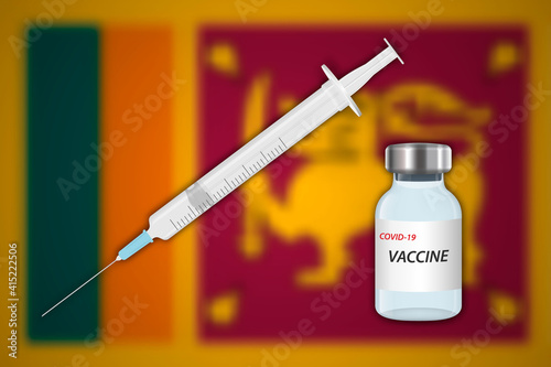 Syringe and vaccine vial on blur background with Sri Lanka flag