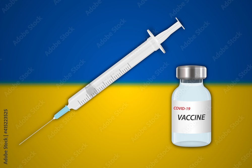 Syringe and vaccine vial on blur background with Ukraine flag