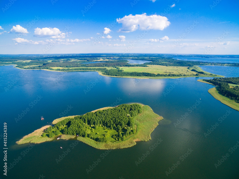 Aerial view of beautiful island on Swiecajty Lake in the neighborhood of Kal village, Mazury, Poland (former Kehlen or Kielno, East Prussia)