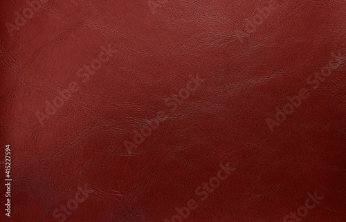 close up dark red leather texture background. abstract retro concept background. top view of genuine leather.