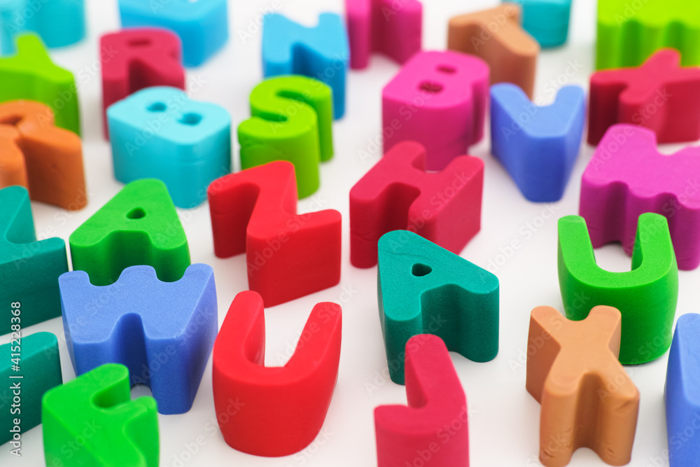 Fototapeta premium Polymer clay letters scattered on a table