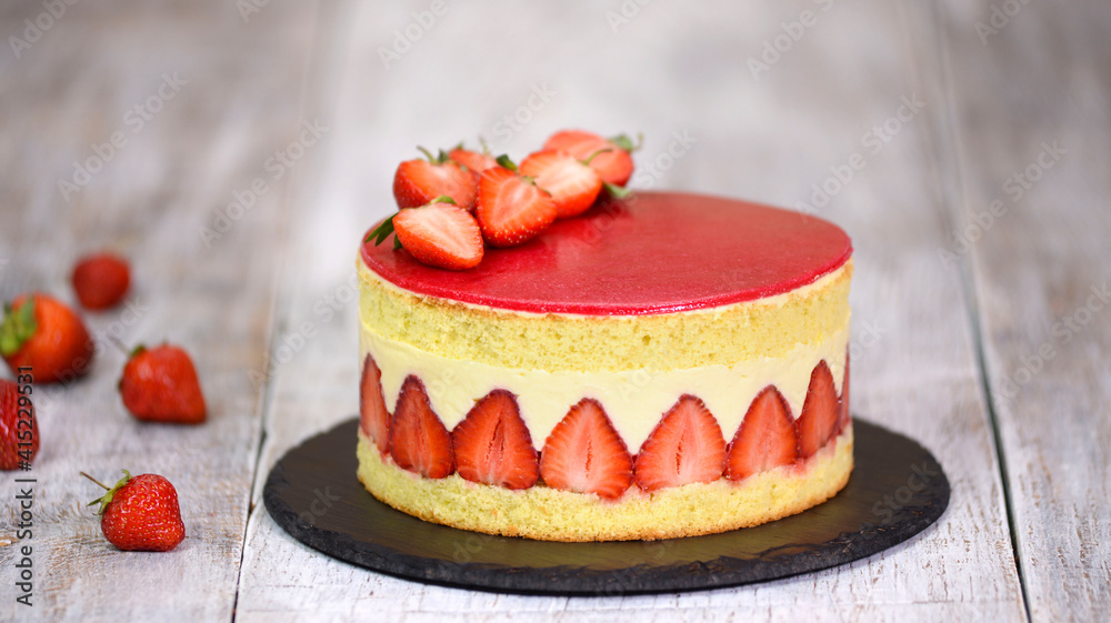 Sponge cake with strawberries and vanilla cream. Strawberry Fraisier cake .