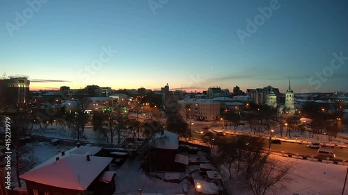 Irkutsk view of the street with a car at sunrise photo