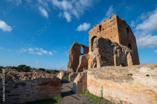 Beautiful architectural perspective of the Imperial Villa of the Quintilii, the caldarium, of the thermal baths, on a beautiful day of blue sky the ruins stand out against the blue. Rome Appia Antica