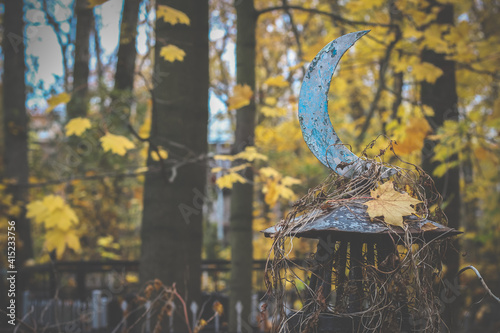 Photography religious symbol of Islam iron steel crescent moon near the grave in the cemeter