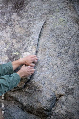 person climbing on rock