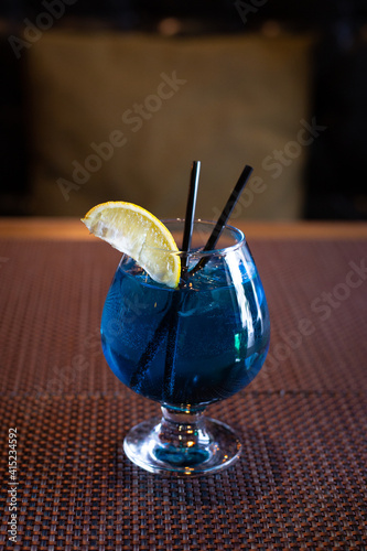 Blue lagoon cocktail with lemon