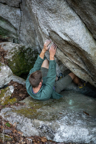 person climbing a rock