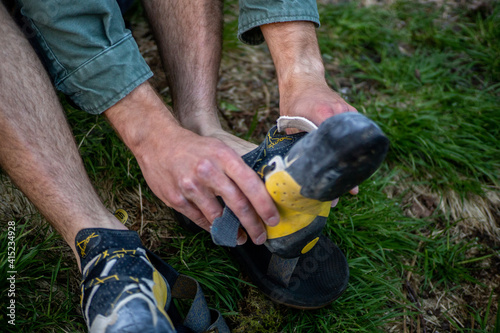 putting on climbing shoes