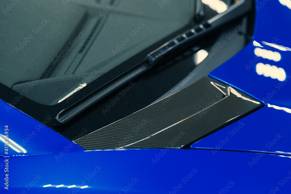 metal parts of the painted car body. shooting close. joint of two parts metal parts of the painted car body. shooting close. joint of two parts
