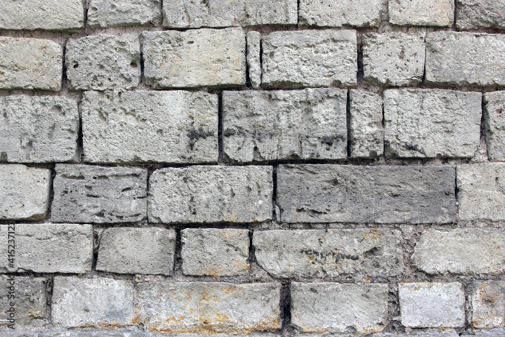 The texture of old masonry. The wall is made of white stone. The texture of old masonry. The wall is made of white stone.