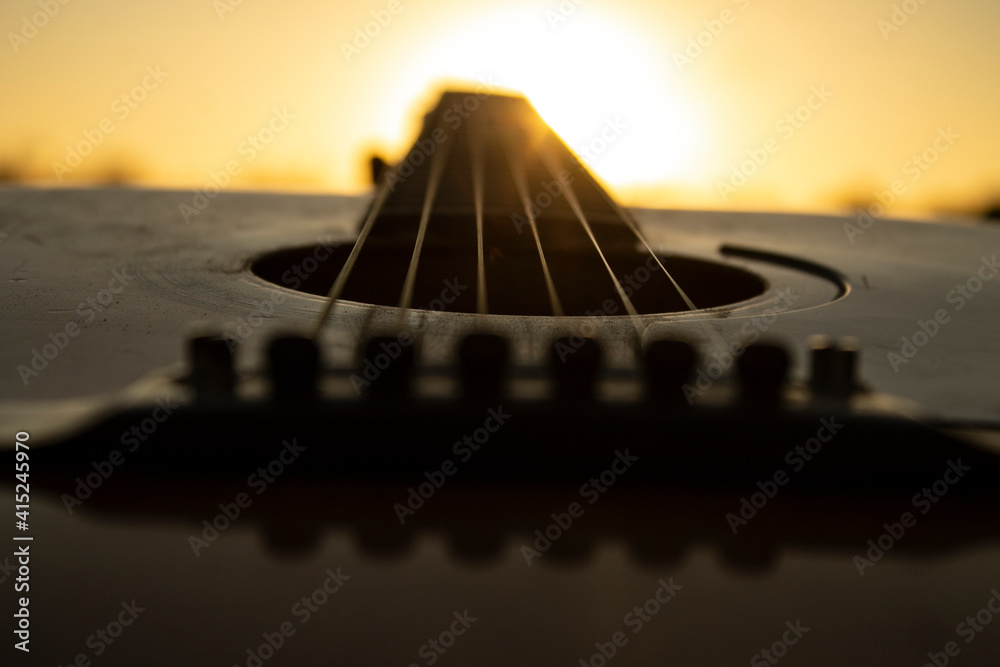 Guitar during the sunset.Playing guitar music with friends during the golden hour,just an hour