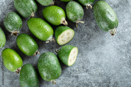 Fresh feijoa fruits on marble wooden background