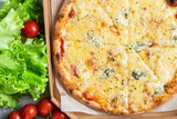 cheesy pizza 4 cheese assorted several types fast food other ingredients portion on the table meal snack top view copy space for text food background rustic image