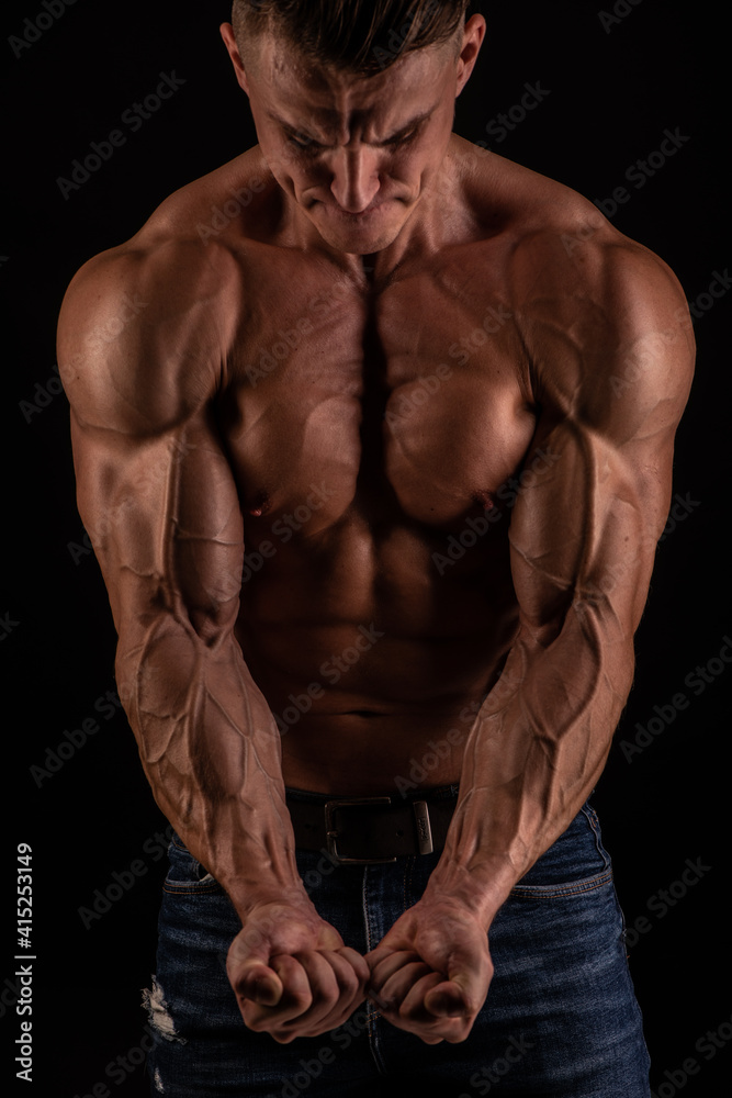 Muscled male model flexing biceps Muscled male model flexing biceps