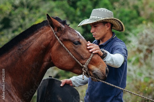 Cowboy creating a connection with his horse