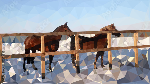 The horses in the corral walk in the snow